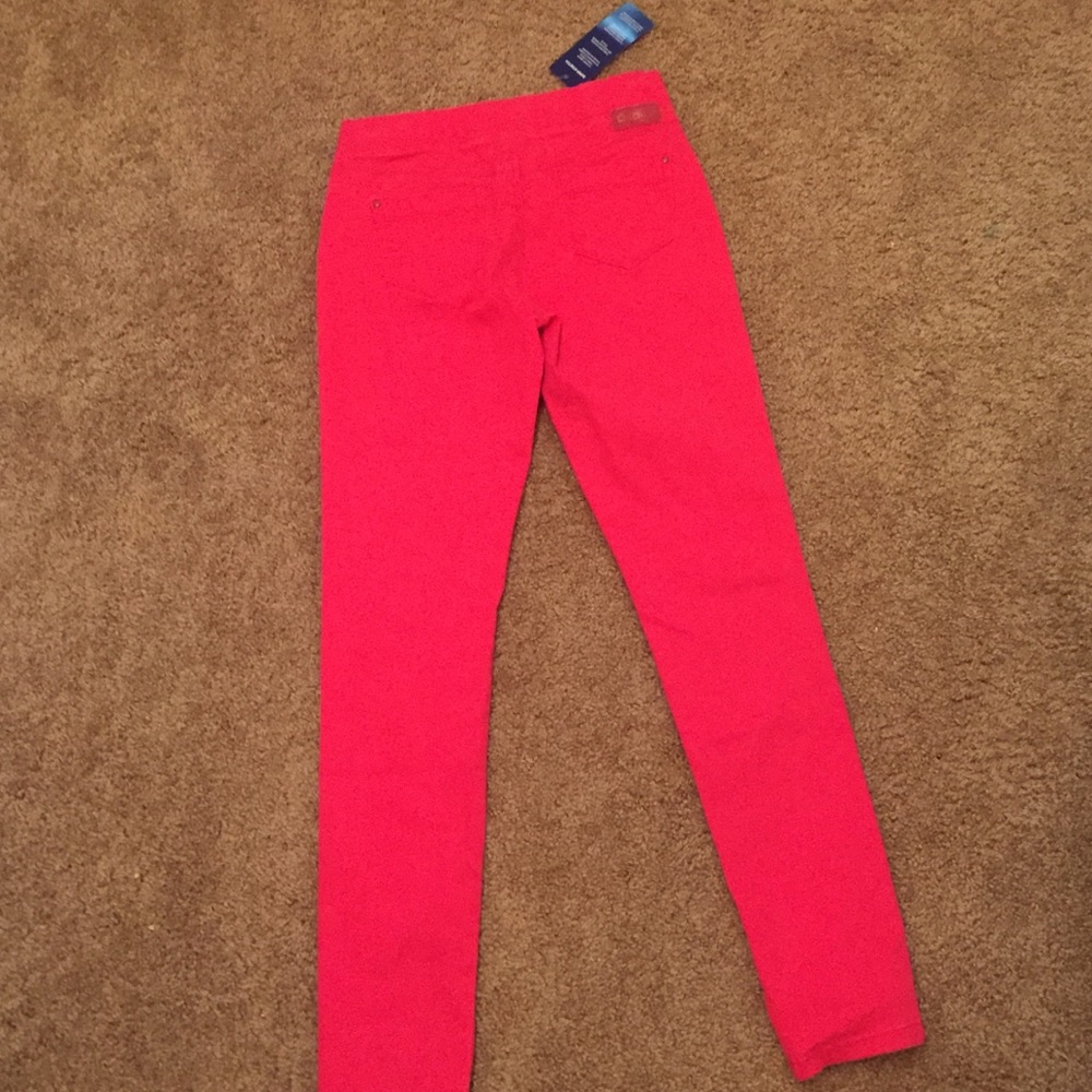 Reddish pink pants.